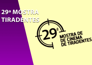 Logotipo oficial da 29ª Mostra de Cinema de Tiradentes em preto e branco sobre fundo amarelo claro, ao lado de uma faixa roxa com o texto informativo do evento. O design destaca o número 29 envolto em um grafismo circular.